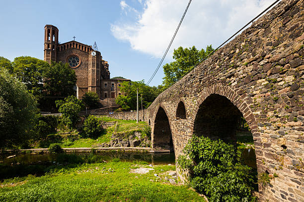 istock church and medieval bridge in Sant Joan les Fonts 457892397