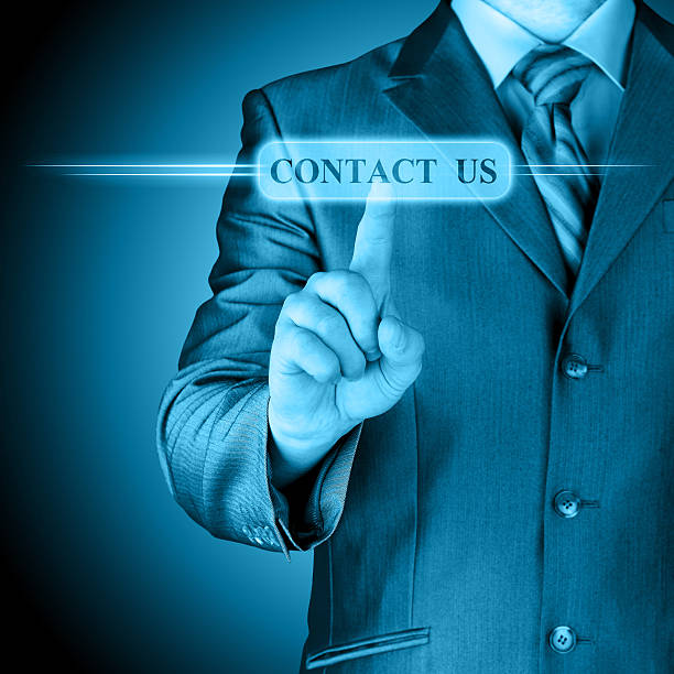 istock Businessman pushing CONTACT US sign 457897707