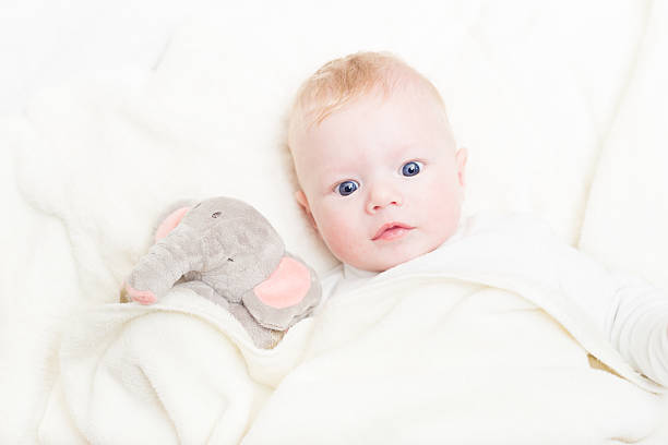 istock Baby with plush toy. 457899099