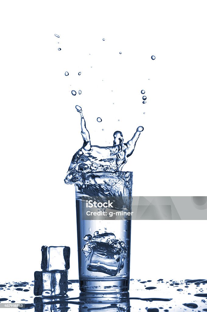 Water splashes in the glass Water splashes in the glass on white background Activity Stock Photo