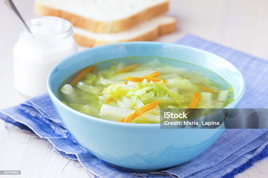 Vegetable soup with cabbage, kohlrabi, carrots, healthy Vegetable soup with cabbage, kohlrabi, carrots, healthy vegetarian diet dish with sour cream and bread Appetizer Stock Photo