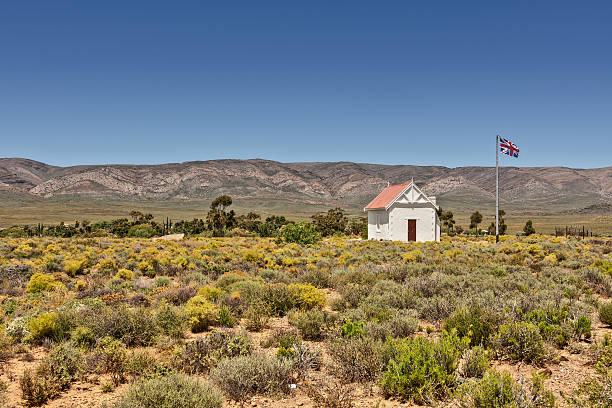 istock African outpost cottage with a British flag 457940351