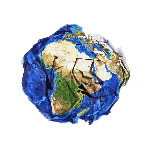 Crumbled paper planet earth stock photo