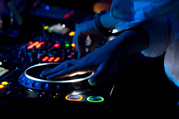 istock DJ mixing and scratching music at a concert 457945579
