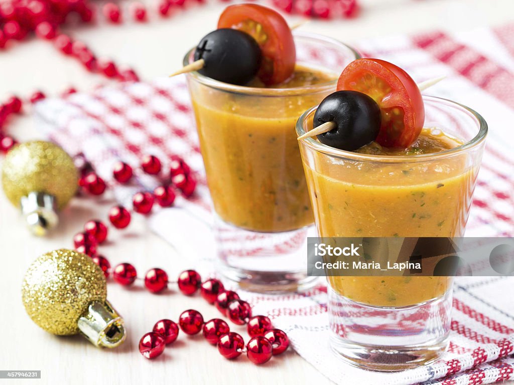 Vegetable soup in small glasses with olives, starter, appetizer Vegetable soup in small glasses with olives, starter, tasty appetizer for guests on christmas party Christmas Stock Photo