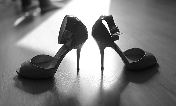 istock Bridal wedding day shoes in black and white. 457947845