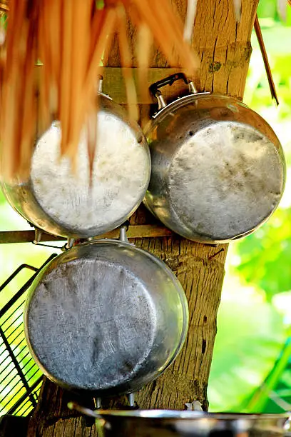 Photo of Round tin pots in a tropical restaurant