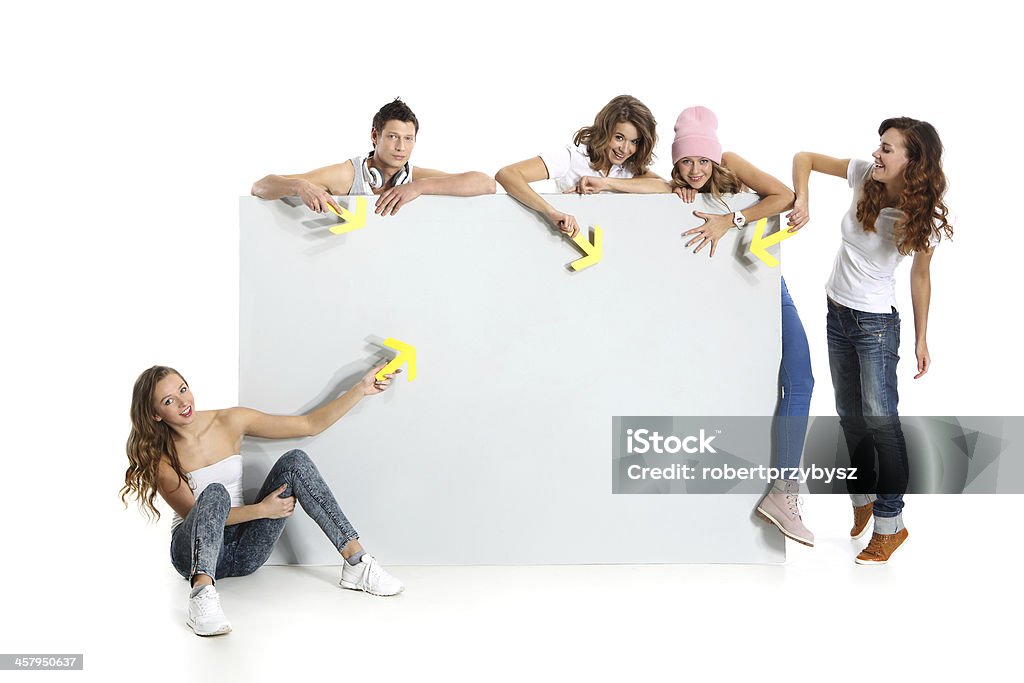 Youth and empty white board Group of young people holding an empty white board with space for text Comparison Stock Photo