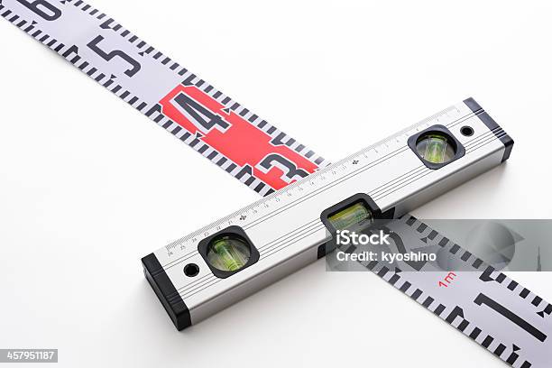 Level Indicator With Tape Measure On White Background Stock Photo - Download Image Now