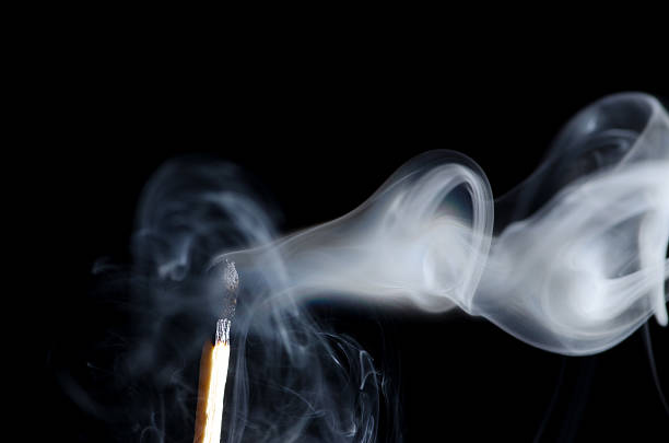 Smoking Matchstick stock photo