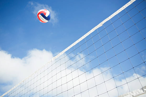 istock Beach Volleyball Mid-Air Above Outdoor Net 457951389