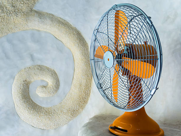 istock Vintage orange electric fan 457958247