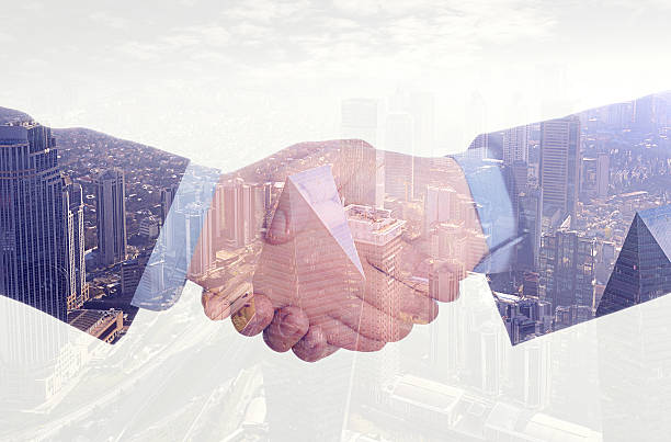 istock Double exposure of business handshake 457962741