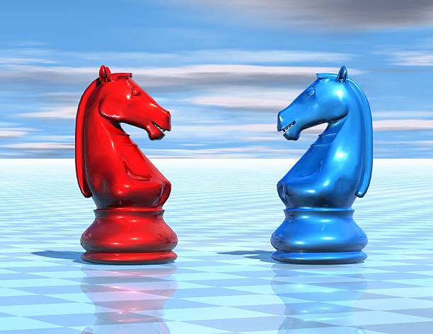 istock red and blue chess horses figurines abstract background with sky 457966795
