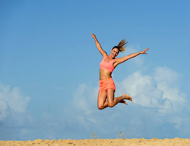 istock Woman Exercising on a Beach 457970617