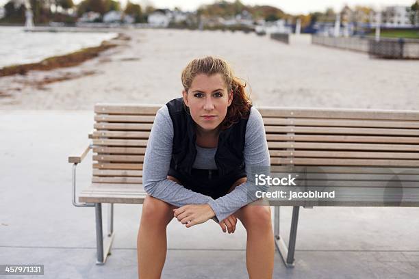 Beautiful Young Woman Taking A Break From Running Stock Photo - Download Image Now - Adult, Adults Only, Athlete