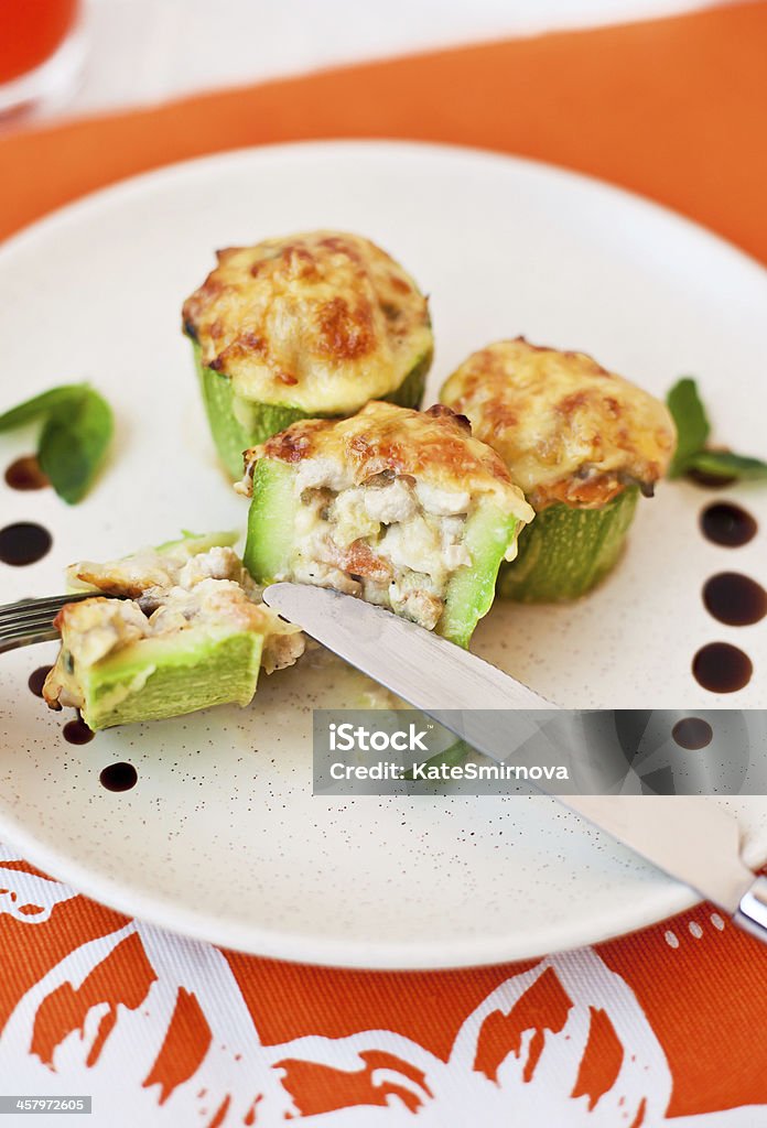 Stuffed zucchini Zucchini stuffed with vegetables, mushrooms and cheese Appetizer Stock Photo