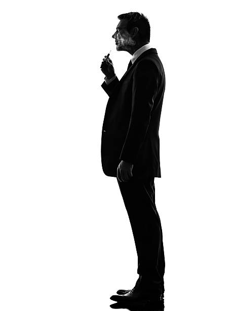 istock business man smoking electronic e-cigarette silhouette 457972831