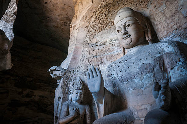istock Giant stone Buddha in Yungang Grotto Shanxi China 457976237