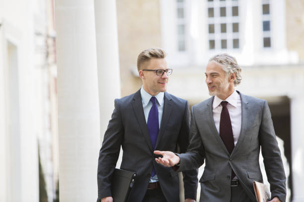 istock Businessmen talking outdoors 457976935