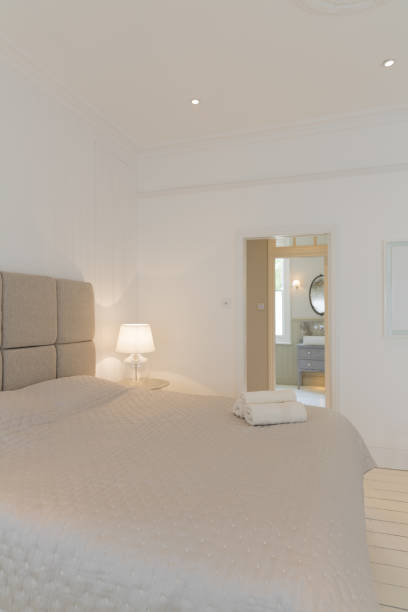 istock Bed and towels in modern bedroom 457977061