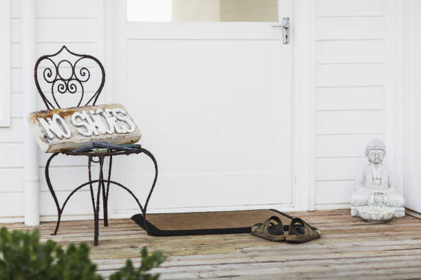 istock No shoes sign on patio 457977383