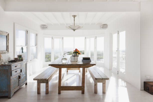 Minimalist designed dining room with sunnt sea view. ( 3d render )