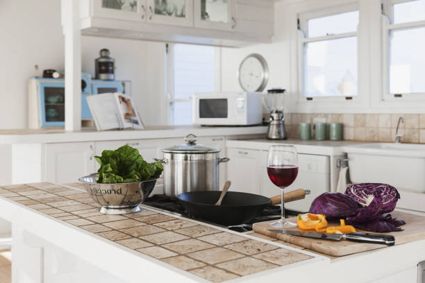 istock Vegetables and glass of red wine in kitchen 457977469