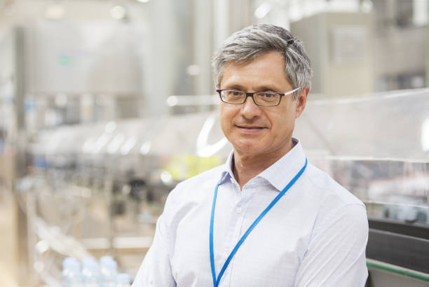 istock Businessman smiling in factory 457978587