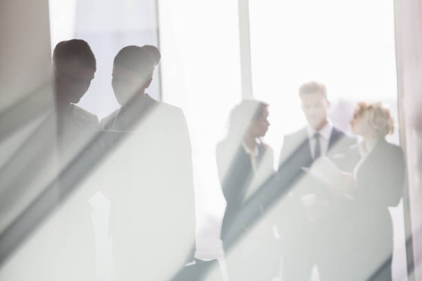 istock Business people talking in sunny office 457978963
