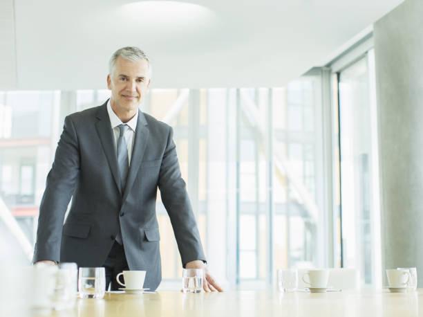 istock Businessman standing in office 457978985