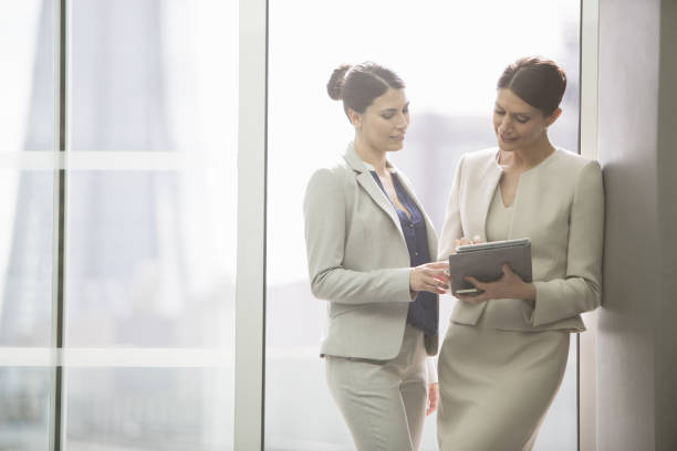 istock Businesswomen using digital tablet in office 457979061