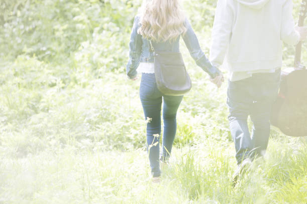 istock Couple holding hands in park 457979589
