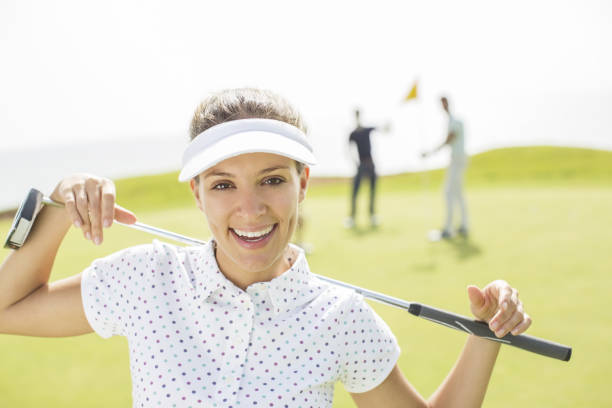 istock Woman holding golf club 457980021