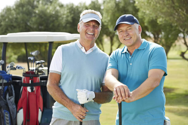 Senior men on golf course  golfer stock pictures, royalty-free photos & images