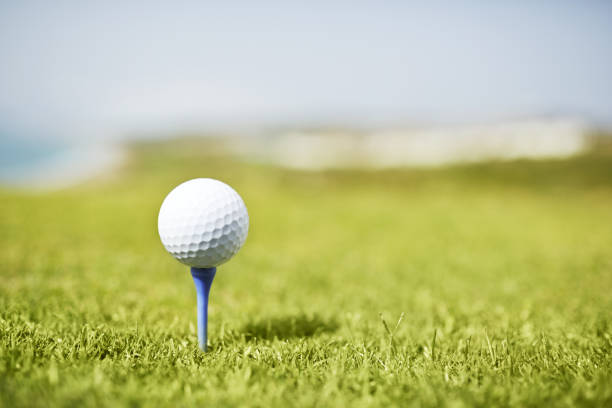 Golf ball on tee  golf course stock pictures, royalty-free photos & images