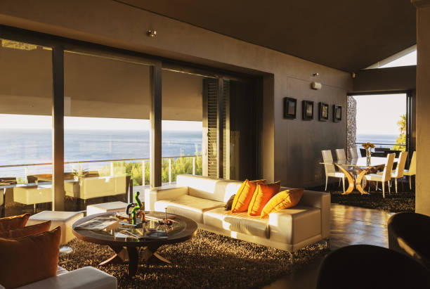 istock Modern living room overlooking ocean 457980411