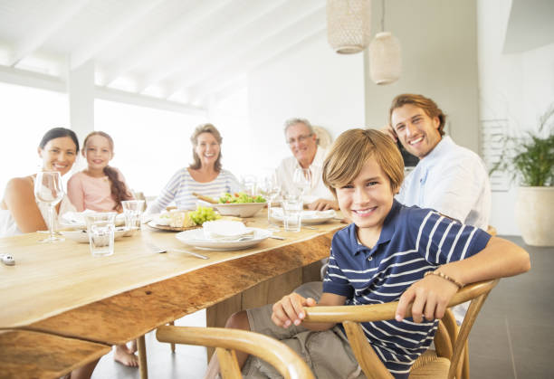 istock Family smiling together at table 457980977