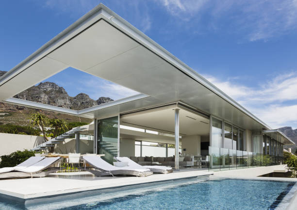 istock Swimming pool and patio outside modern house 457982201