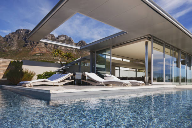 istock Swimming pool and patio outside modern house 457982215