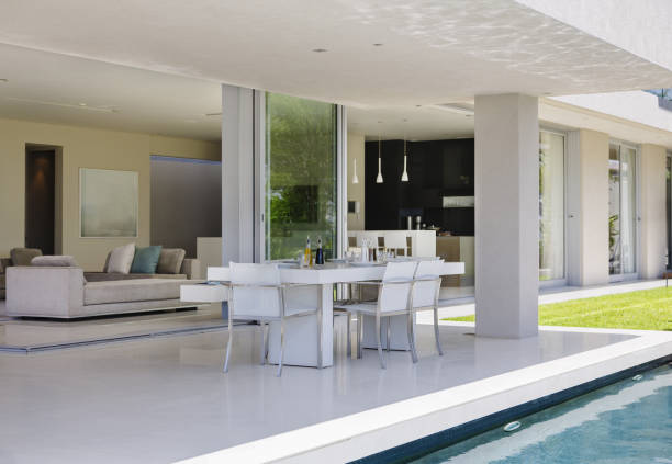 istock Set table on patio by pool of modern house 457982549