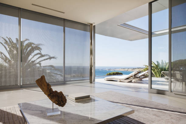 istock Modern living room and patio overlooking ocean 457982655