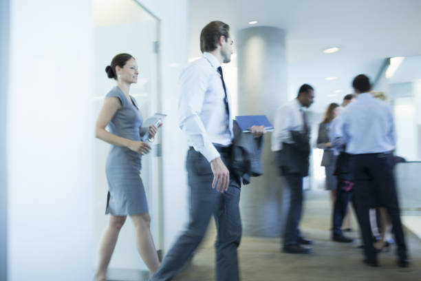 istock Business people walking in office 457982867