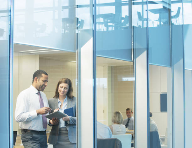 istock Business people talking in conference room 457983289