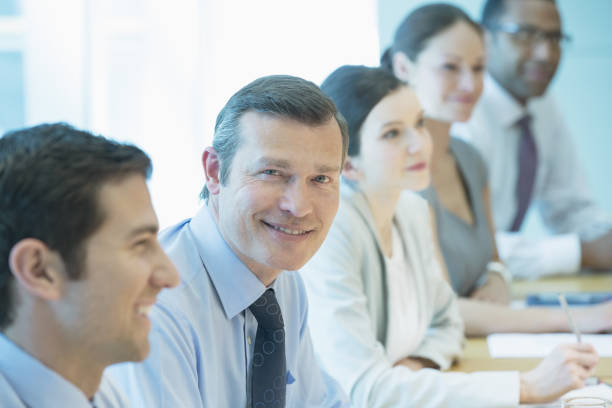 istock Businessman smiling in meeting 457983679
