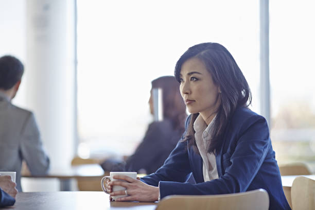 istock Businesswoman drinking coffee in cafe 457983803