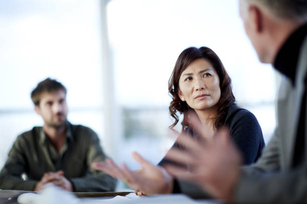Business people talking in meeting grave stock pictures, royalty-free photos & images
