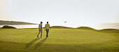 istock Men walking on golf course 457984483