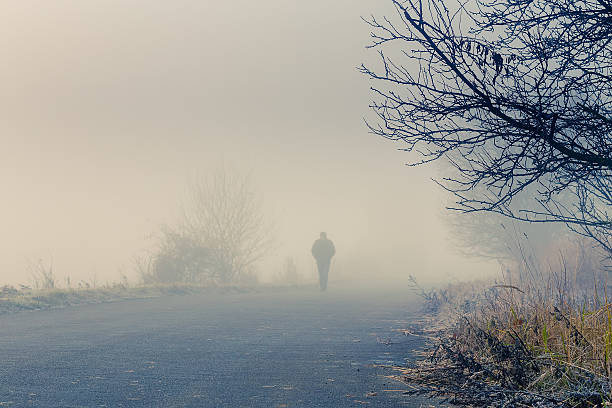 istock men silhouette in the fog 457995283