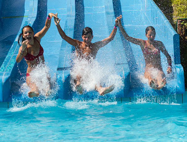 scivolo acquatico - cheerful swimming pool happiness resort swimming pool foto e immagini stock